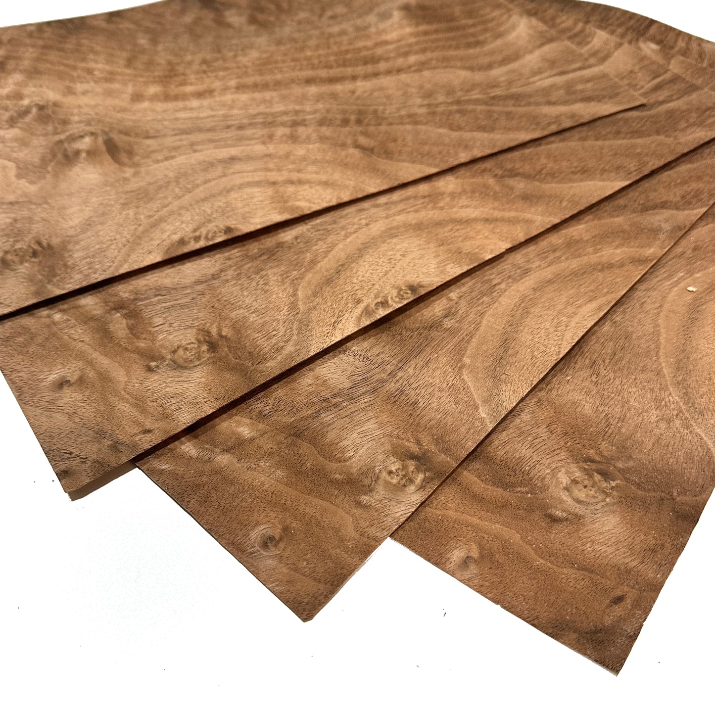 Three wooden planks with a natural brown finish on a white background