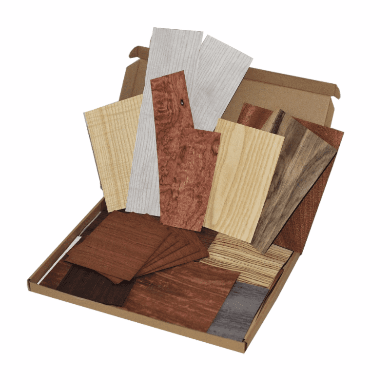 Box of natural wood veneer offcuts.