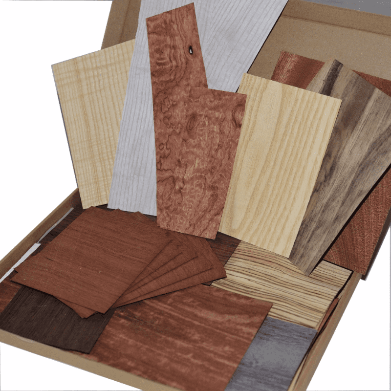 Box of natural wood veneer offcuts.